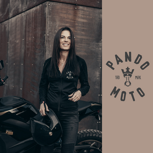 A women with her motorcycle wearing Pando Moto motorcycle clothes for women