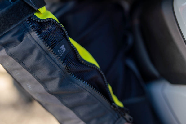 A close up of the sleeve zip on the shima motorcycle touring jacket for women in black/ fluo