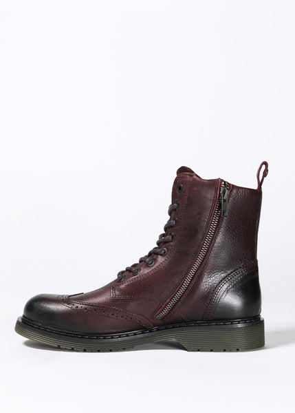 A Women's motorcycle boot in burgundy from John Doe from the side