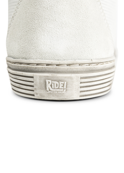 a close up of a back sole of A white women's motorcycle shoe - sneaker from John Doe 