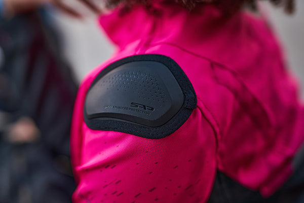 A close up of the slider on the pink DRIFT  motorcycle jacket from Shima