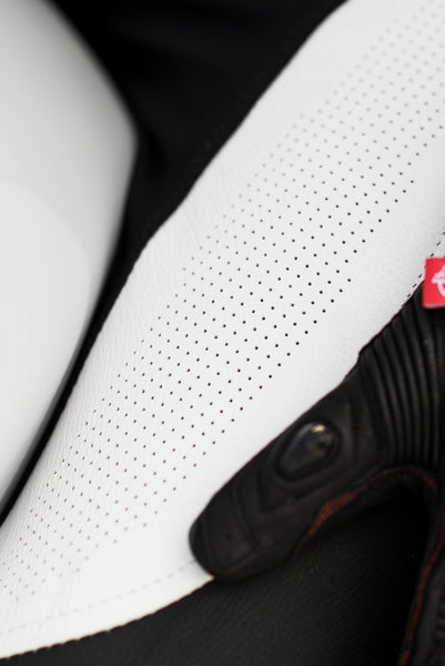A close up of the material of Women's racing suit MIURA RS in black, white and fluo from Shima 