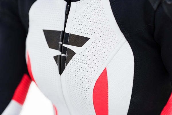 A close up of woman's chest wearing Women's racing suit MIURA RS in black, white and fluo from Shima 