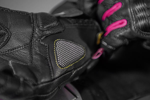 A close up of a palm of Black and pink women's motorcycle gloves Rush lady  from Shima
