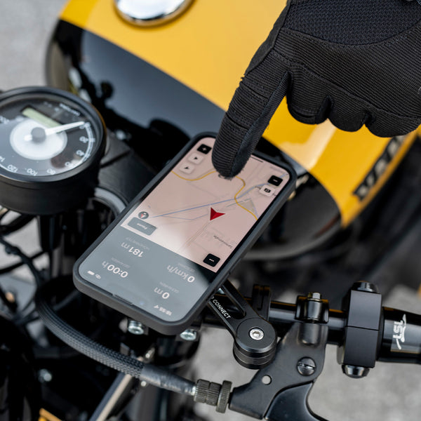 A phone mounted on a motorcycle handlebar