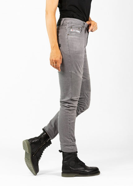 Woman's legs from the side wearing light grey women's motorcycle jeans from JohnDoe