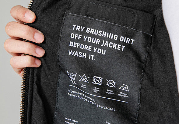 Washing instructions on a Black women's motorcycle hoodie